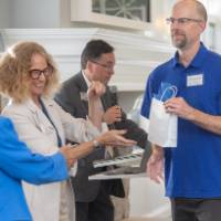 Denton Bobeldyk receiving his bag